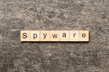 Fototapeta premium spyware word written on wood block. spyware text on cement table for your desing, concept