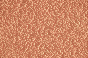 Abstract trendy background. Gentle peach color background Peach Fuzz plaster texture.
