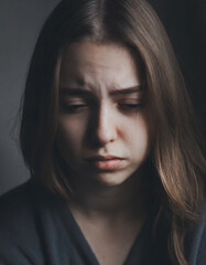 Fototapeta premium Sad and lonely teenage girl with teardrops, depression and loneliness concept