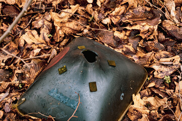 Broken Cathode Electron Beam Tube of Old TV, shattered television trash in the woods, littering in...
