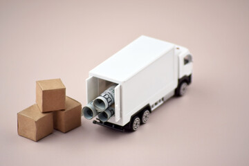 White toy truck with boxes on a light background, space for text.