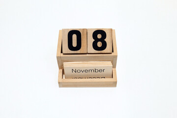 8th of November wooden perpetual calendar. Shot close up isolated on a white background 