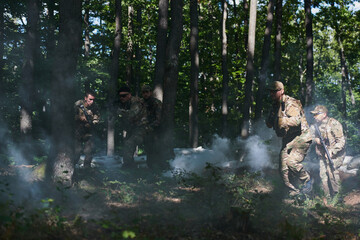 A specialized military antiterrorist unit conducts a covert operation in dense, hazardous woodland,...