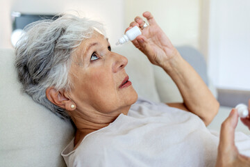 Senior woman, vision and, eye care medicine and eye drops for help with eyesight problem. Medical...