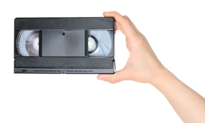 Woman hand holds a retro old analog video cassette, isolated on white background, retro things concept