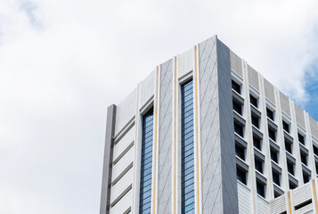 Bottom up view modern office building on blue sky background