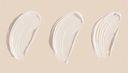 Smears of liquid foundation isolated on beige background. Different skin tone bb cream swatches
