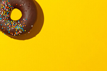 chocolate donuts on a yellow background