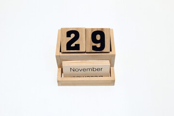 29th of November wooden perpetual calendar. Shot close up isolated on a white background