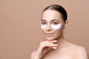 Portrait, woman and face with eye patch application for skin hydration glow, wellness or feel...