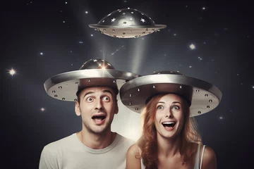 Foto op Plexiglas man and woman holding metallic hats, exaggerated emotions, futuristic spaceship, ufos in the sky, conspiracy theory concept © zgurski1980