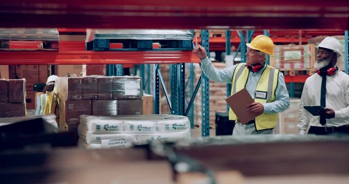 Man, supply chain and team checking storage for inspection, inventory or production in warehouse. Male person, engineer or contractors walking with clipboard and tablet for stock and quality control