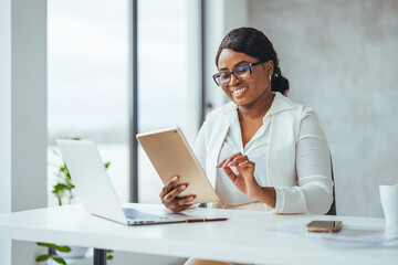 Thinking about how to take the business to technological heights. Cropped shot of an attractive young businesswoman working in her office. Young businesswoman using digital tablet