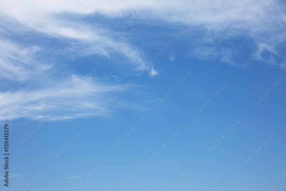 Wall mural blue sky and fantastic soft white clouds , horizontal shape with space for design. web banner. wide.