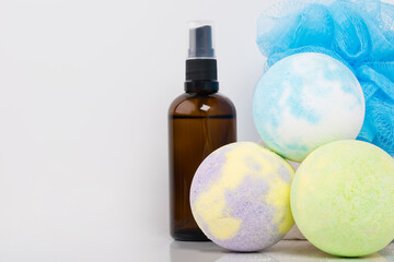 oil and foam for baths in the spa on a light background