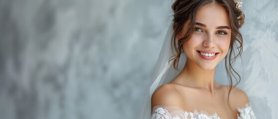 wedding advertising bride standing . she is wearing a beautiful dress and she is smiling. on a gray background, with empty copy space