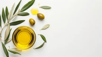 Fototapeten olive oil and olive branch on a white background top view copy space © standret