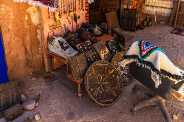 Souvenir shop with carpets, traditional clothes and other things in clay town of Ait Ben Haddou,...