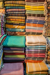Traditional Turkish clothes in the bazaar, a vibrant display of cultural textiles, patterns, and garments, creating a marketplace of diverse textures and fashion.