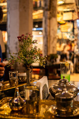 Explore the opulence of an old Turkish coffee set, a vintage display of ornate copper and ceramic artifacts, preserving cultural heritage and offering a timeless brewing experience.