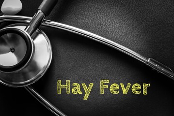 Hay Fever term isolated with stethoscope on a black background
