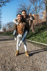 Fototapeta premium Man piggybacking his boyfriend