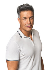 Confident middle-aged Hispanic man posing stylishly in studio