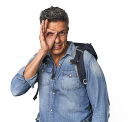 Hispanic hiker with backpack and flask excited keeping ok gesture on eye.