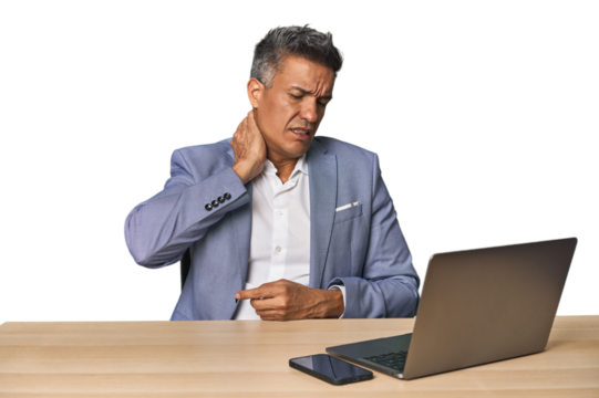 Elegant businessman at desk with laptop having a neck pain due to stress, massaging and touching it with hand. - Powered by Adobe