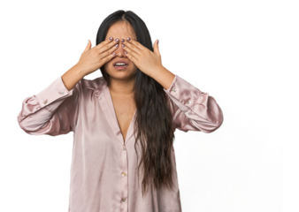 Young chinese woman isolated afraid covering eyes with hands.