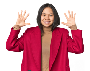 Young chinese woman isolated showing number ten with hands.