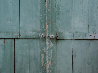 The doors of an old cabinet in turquoise