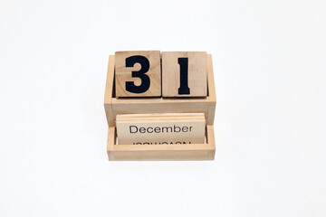31st of December wooden perpetual calendar. Shot close up isolated on a white background 