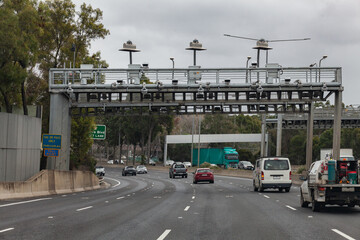E tag toll point on multi lane city road on grey overcast day