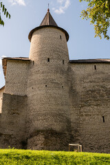 Pskov, Russia, September 6, 2023. Trinity tower of the Kremlin and a fragment of the fortress wall.