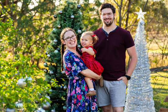Triangle family of three laughing together at Christmas