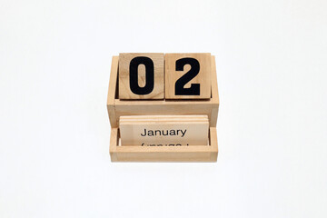 2nd of January wooden perpetual calendar. Shot close up isolated on a white background 