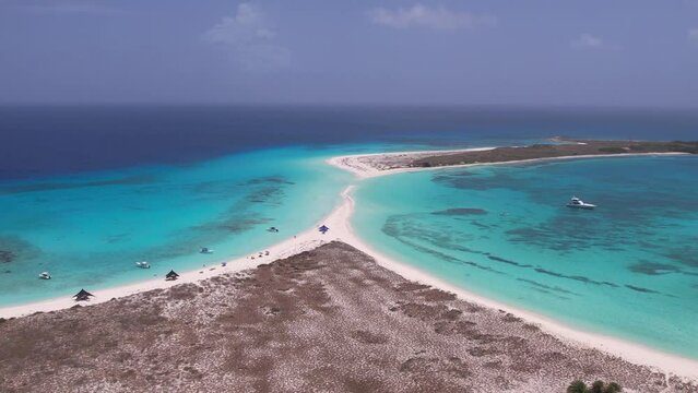 Cayo de Agua sand isthmus island surrounded by clear light blue ocean water