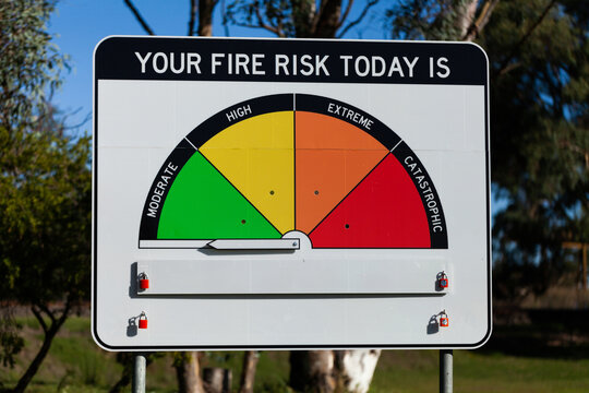 New fire danger rating sign with arrow yet to be assigned in bright sunlight at roadside