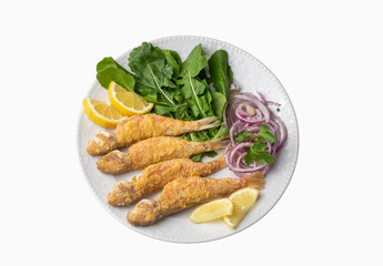 Plate of fried small fish red mullet and lemon
