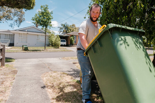 Man with Down Syndrome Bringing In Wheely Bin