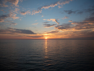 Golden Hour Serenity: Tranquil Summer Evening by the Sea with Sunset, Clouds, and Calm Waters - Peaceful Beauty of Nature, People-Free