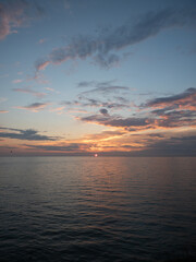 Golden Hour Serenity: Tranquil Summer Evening by the Sea with Sunset, Clouds, and Calm Waters - Peaceful Beauty of Nature, People-Free