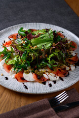 salad of vegetables, cheese, duck meat
