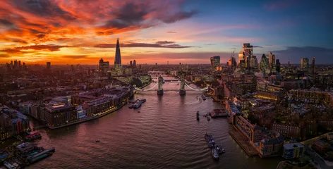 Poster de jardin Tower Bridge Panoramic aerial view of the London skyline with Tower Bridge, River Thames, City and Elephant and castle, during a fiery sunset