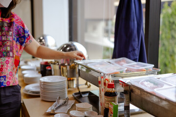 People hand grab buffet asian food in hotel seminar room