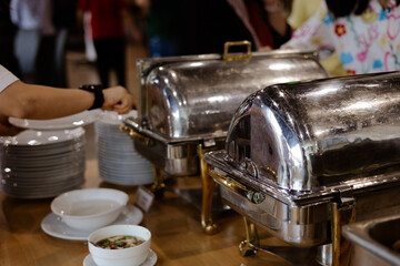 People hand grab buffet asian food in hotel seminar room