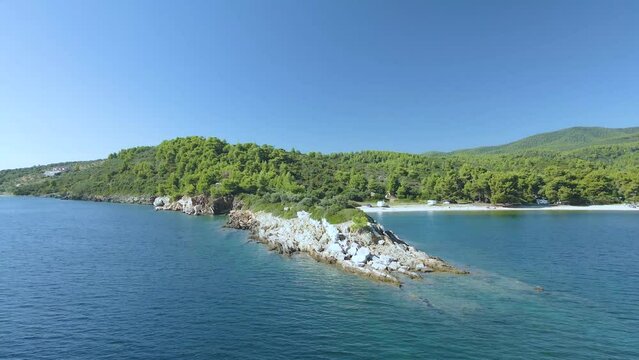 4K drone clip over a rock formation in the tropical blue waters of Toroni in Chalkidiki