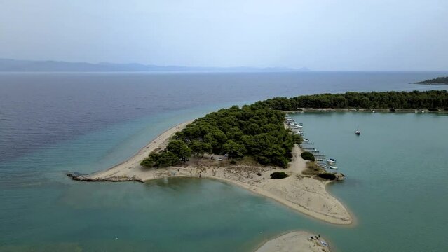 Cinematic rotating 4K drone clip over a peninsula in Paliouri, Chalkidiki in North Greece