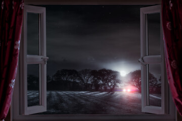 Open window at night with car lights - 728480474
